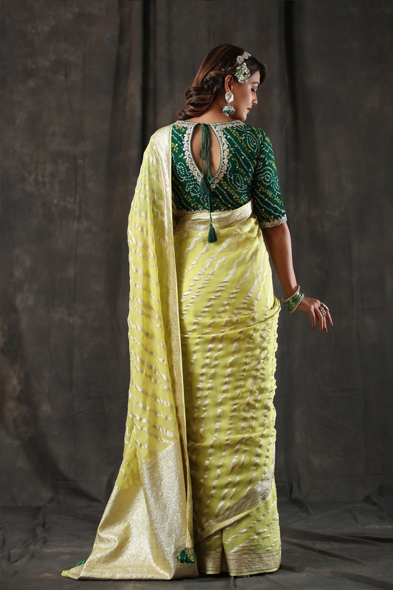 Buy lemon yellow georgette Banarasi saree online in USA with zari stripes. Make a fashion statement at weddings with stunning designer sarees, embroidered sarees with blouse, wedding sarees, handloom sarees from Pure Elegance Indian fashion store in USA.-back