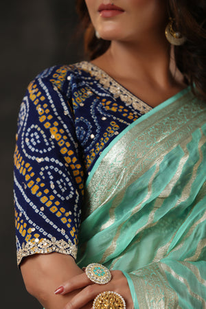 Shop mint green georgette Banarasi saree online in USA with zari stripes. Make a fashion statement at weddings with stunning designer sarees, embroidered sarees with blouse, wedding sarees, handloom sarees from Pure Elegance Indian fashion store in USA.-blouse
