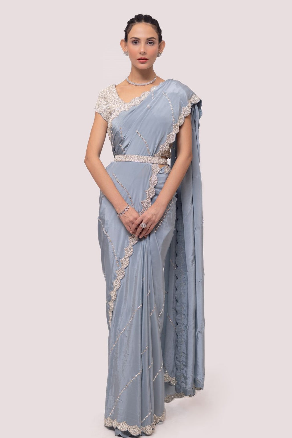 Shop blue crepe saree featuring Cheed, sequin, and cut dana work, embroidered sleeves blouse detailing is a perfect choice for parties! It comes with a designer saree blouse. Make a fashion statement at weddings with stunning designer sarees, embroidered sarees with blouses, wedding sarees, and handloom sarees from Pure Elegance Indian fashion store in the USA.
