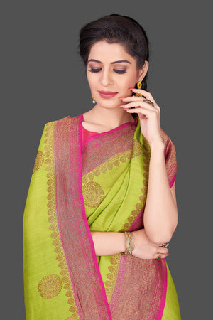 Buy pista green muga Banarasi saree online in USA with pink zari border. Shop beautiful Banarasi sarees, georgette sarees, pure muga silk sarees in USA from Pure Elegance Indian fashion boutique in USA. Get spoiled for choices with a splendid variety of Indian saris to choose from! Shop now.-closeup