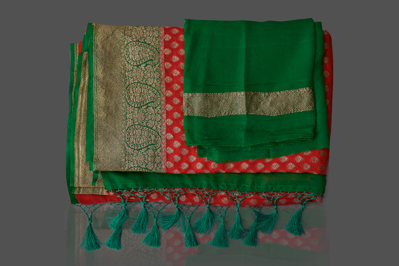Buy beautiful red georgette Banarasi saree online in USA with green antique zari border. Shop beautiful Banarasi sarees, georgette sarees, pure muga silk sarees in USA from Pure Elegance Indian fashion boutique in USA. Get spoiled for choices with a splendid variety of Indian saris to choose from! Shop now.-details