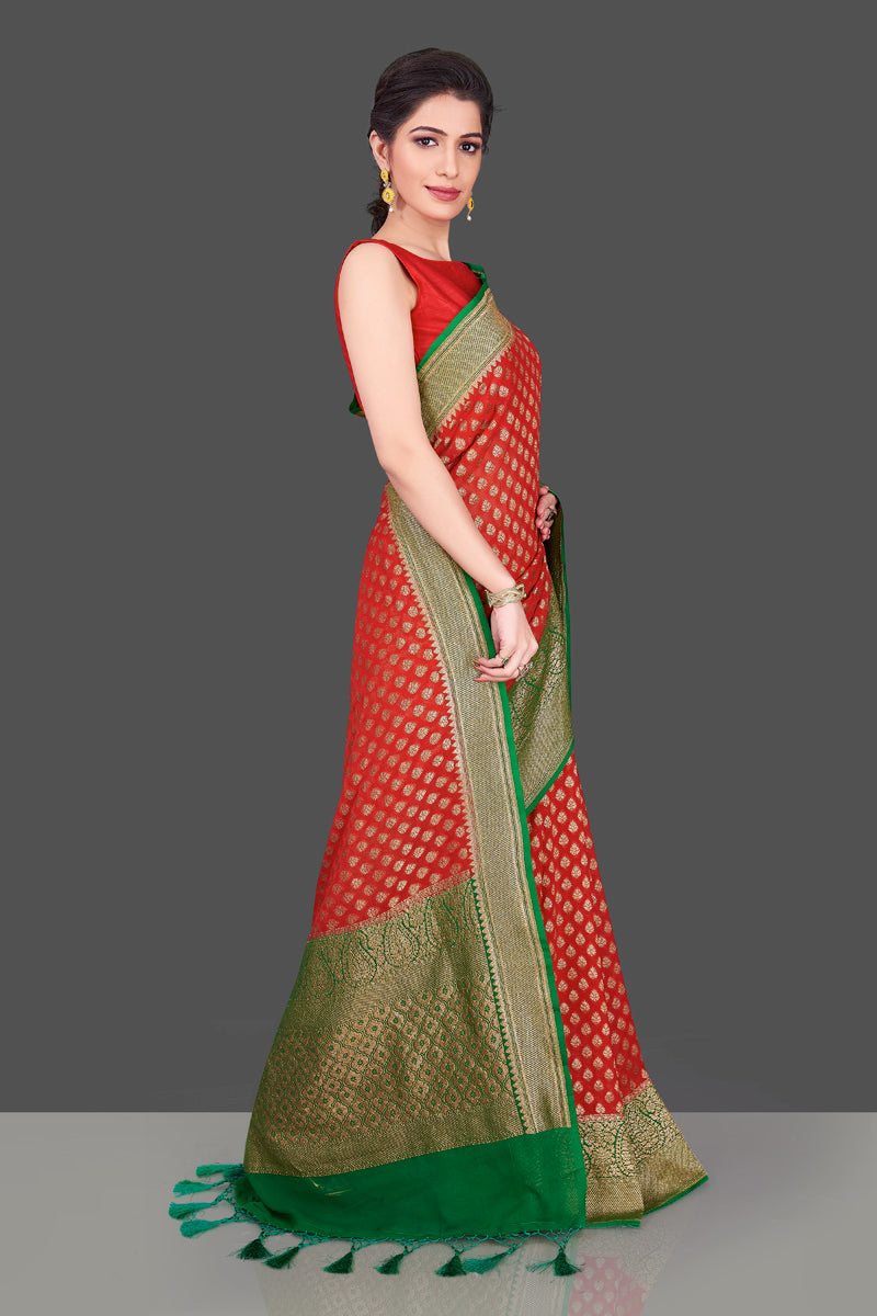Buy beautiful red georgette Banarasi saree online in USA with green antique zari border. Shop beautiful Banarasi sarees, georgette sarees, pure muga silk sarees in USA from Pure Elegance Indian fashion boutique in USA. Get spoiled for choices with a splendid variety of Indian saris to choose from! Shop now.-side
