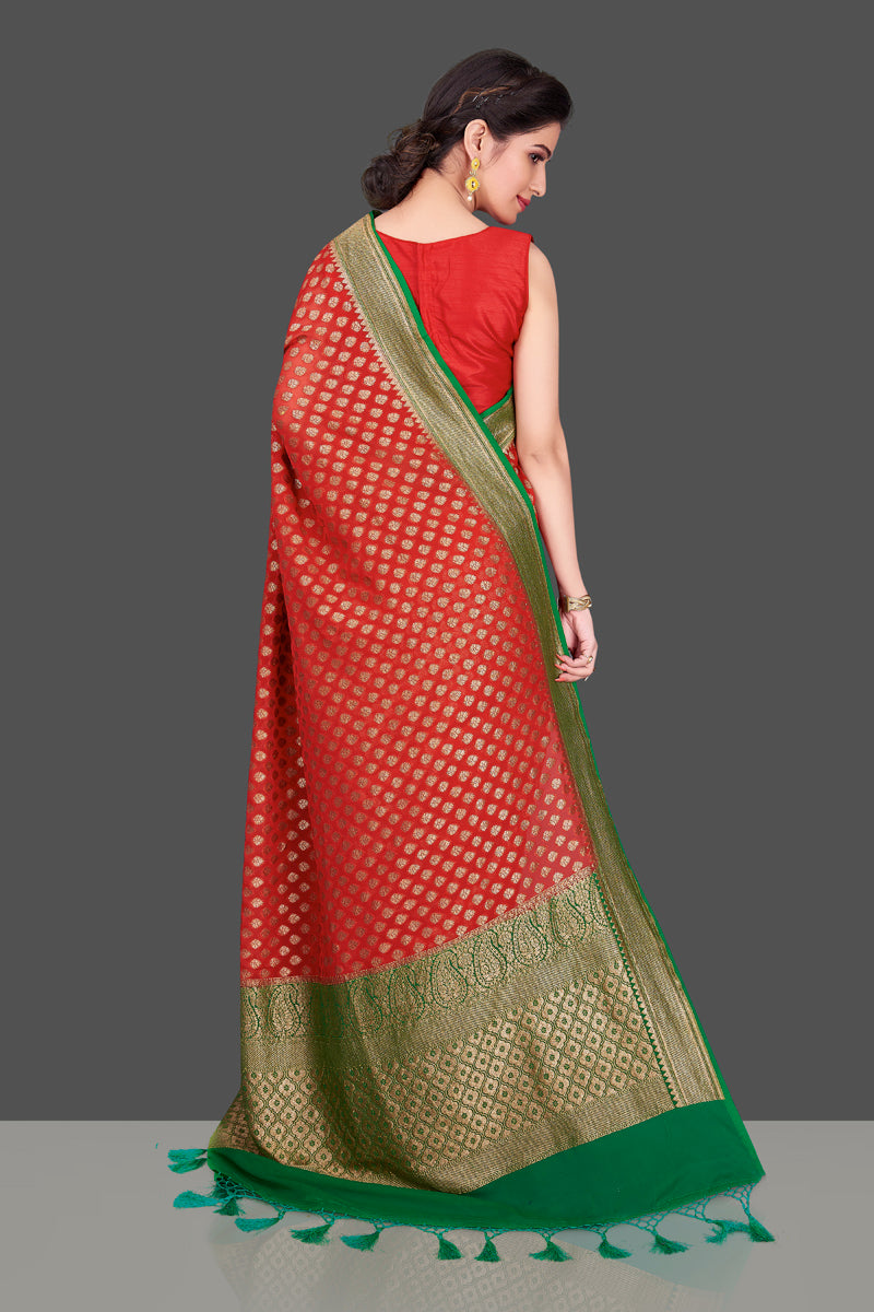 Buy beautiful red georgette Banarasi saree online in USA with green antique zari border. Shop beautiful Banarasi sarees, georgette sarees, pure muga silk sarees in USA from Pure Elegance Indian fashion boutique in USA. Get spoiled for choices with a splendid variety of Indian saris to choose from! Shop now.-back