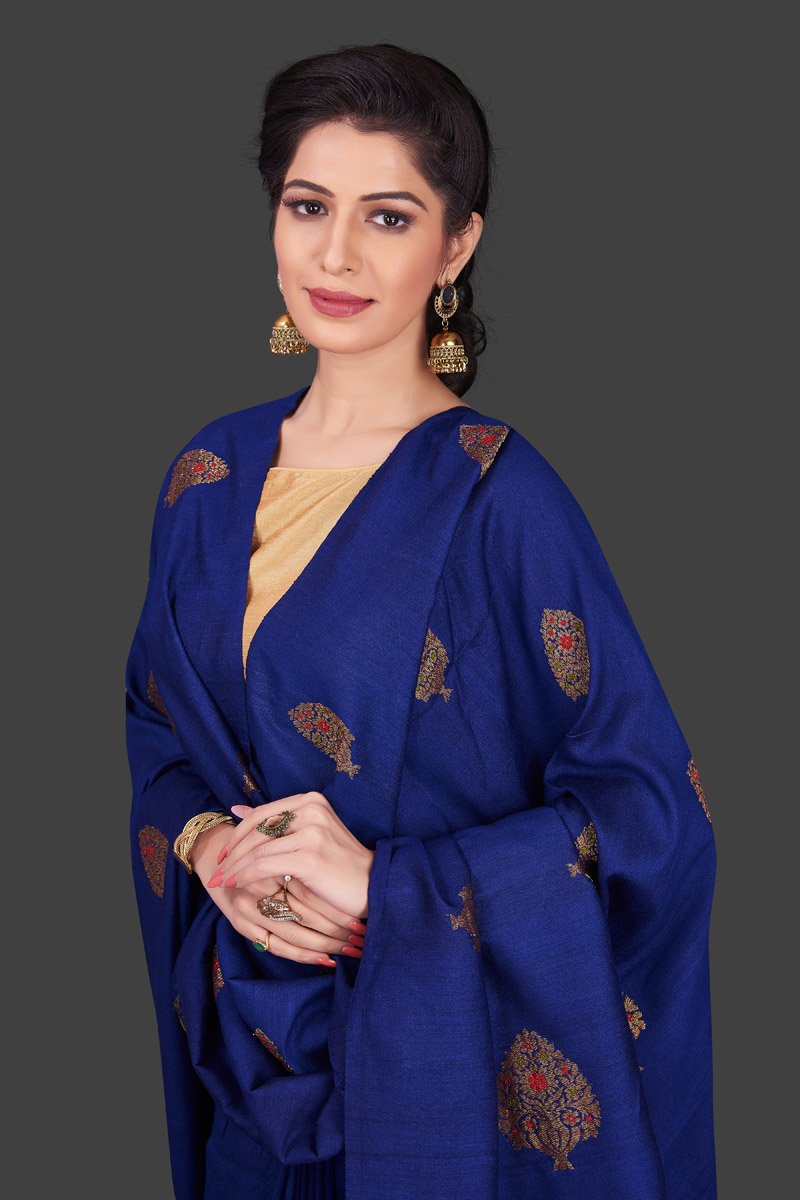 Buy stunning dark blue borderless muga Banarasi sari online in USA with floral zari buta. Shop beautiful Banarasi sarees, georgette sarees, pure muga silk sarees in USA from Pure Elegance Indian fashion boutique in USA. Get spoiled for choices with a splendid variety of designer saris to choose from! Shop now.-closeup