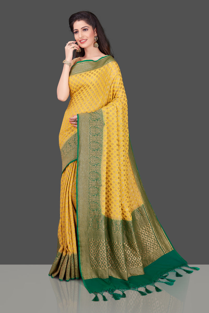 Shop lovely yellow georgette Banarasi saree online in USA with green zari border. Shop beautiful Banarasi georgette sarees, tussar sarees, pure muga silk sarees in USA from Pure Elegance Indian fashion boutique in USA. Get spoiled for choices with a splendid variety of Indian saris to choose from! Shop now.-side