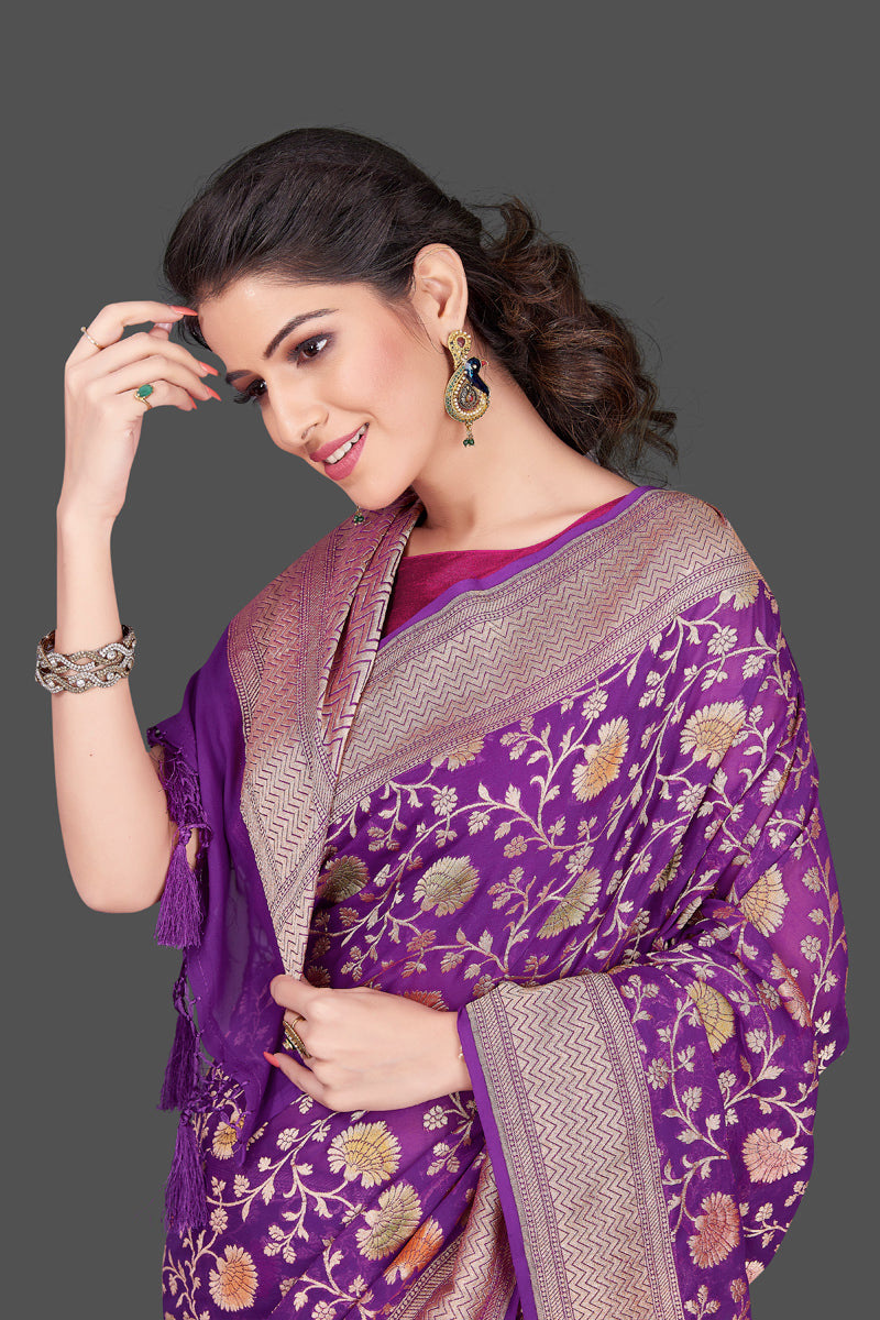 Shop purple georgette Benarasi sari online in USA with floral zari jaal. Shop beautiful Banarasi georgette sarees, tussar sarees, pure muga silk saris in USA from Pure Elegance Indian fashion boutique in USA. Get spoiled for choices with a splendid variety of Indian sarees to choose from! Shop now.-closeup