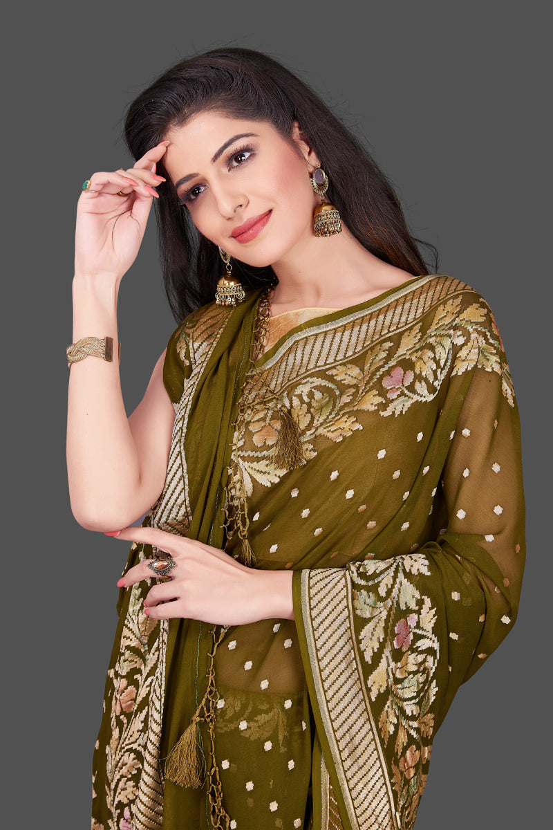 Buy mehendi green Benarasi georgette saree online in USA with floral zari border. Shop beautiful Banarasi georgette sarees, tussar sarees, pure muga silk saris in USA from Pure Elegance Indian fashion boutique in USA. Get spoiled for choices with a splendid variety of Indian sarees to choose from! Shop now.-closeup