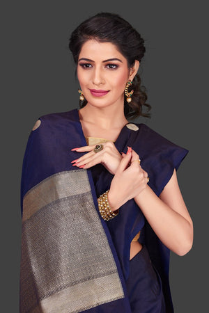 Buy navy blue borderless Banarasi saree in USA with polka zari buta. Shop beautiful Banarasi georgette sarees, tussar saris, pure muga silk saris in USA from Pure Elegance Indian fashion boutique in USA. Get spoiled for choices with a splendid variety of Indian sarees to choose from! Shop now.-closeup
