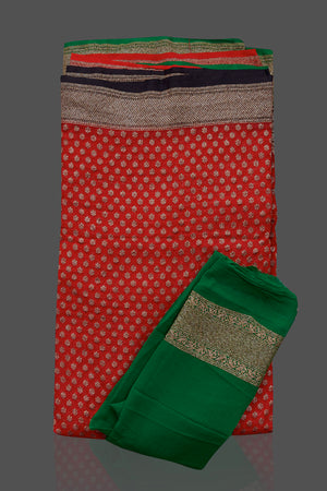 Shop stunning red georgette Benarasi saree in USA with black green zari border. Shop beautiful Banarasi georgette sarees, tussar saris, pure muga silk saris in USA from Pure Elegance Indian fashion boutique in USA. Get spoiled for choices with a splendid variety of Indian sarees to choose from! Shop now.-details