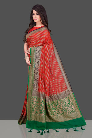Shop stunning red georgette Benarasi saree in USA with black green zari border. Shop beautiful Banarasi georgette sarees, tussar saris, pure muga silk saris in USA from Pure Elegance Indian fashion boutique in USA. Get spoiled for choices with a splendid variety of Indian sarees to choose from! Shop now.-side
