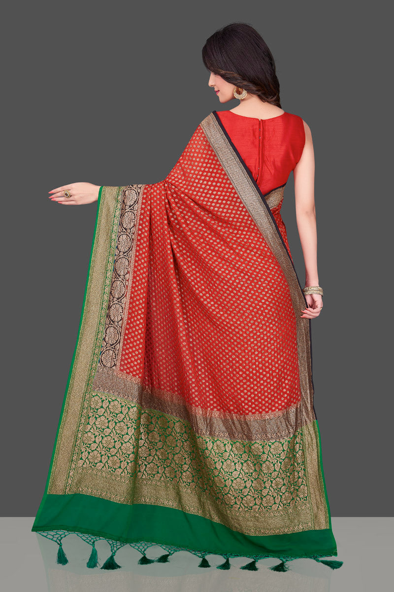 Shop stunning red georgette Benarasi saree in USA with black green zari border. Shop beautiful Banarasi georgette sarees, tussar saris, pure muga silk saris in USA from Pure Elegance Indian fashion boutique in USA. Get spoiled for choices with a splendid variety of Indian sarees to choose from! Shop now.-back