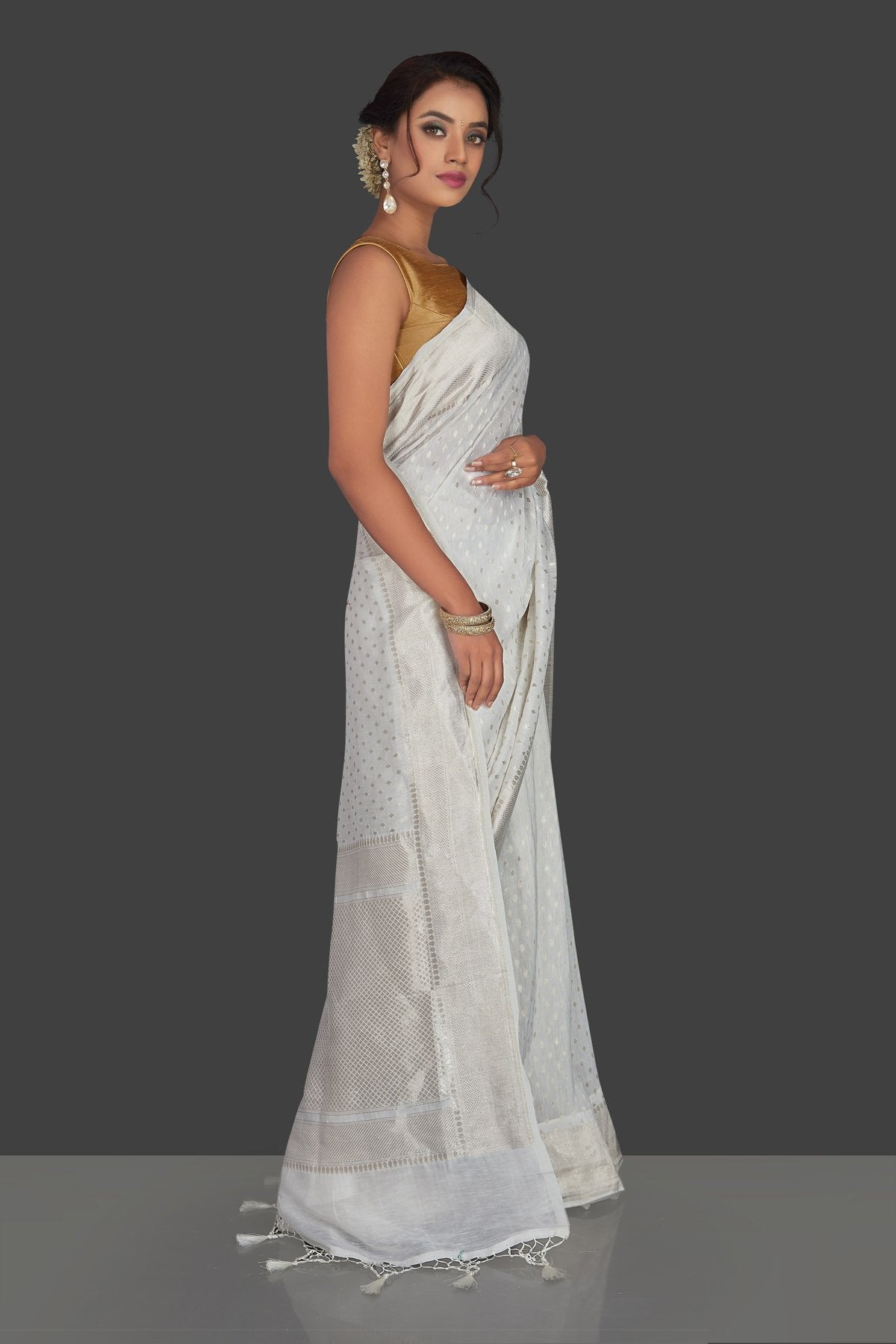 Shop white tassar georgette Banarsi saree online in USA with silver zari border. Radiate elegance with handloom sarees with blouse, tussar silk saris, Banarsi sarees from Pure Elegance Indian fashion boutique in USA. We bring a especially curated collection of ethnic saris for Indian women in USA under one roof!-pallu