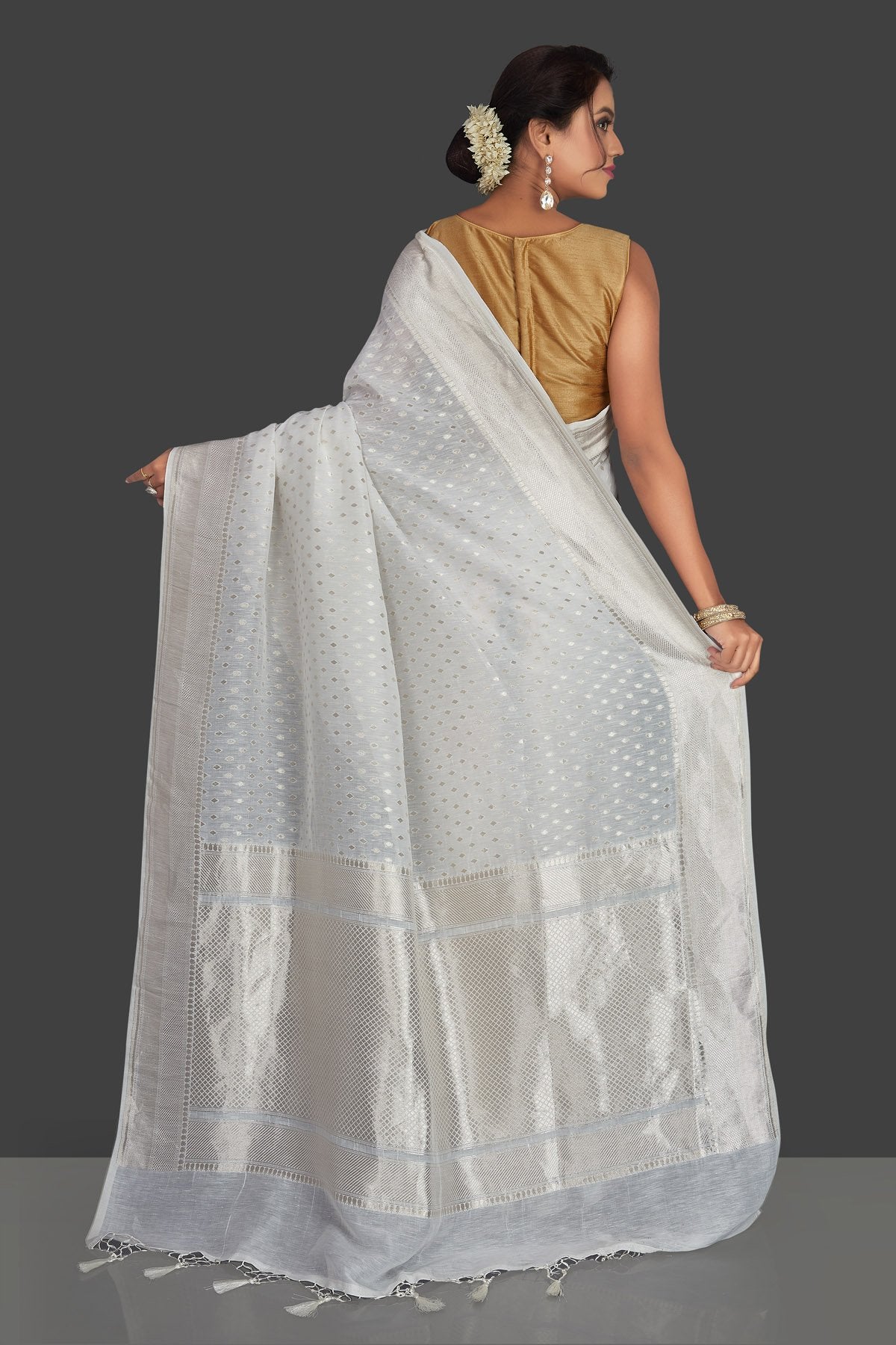 Shop white tassar georgette Banarsi saree online in USA with silver zari border. Radiate elegance with handloom sarees with blouse, tussar silk saris, Banarsi sarees from Pure Elegance Indian fashion boutique in USA. We bring a especially curated collection of ethnic saris for Indian women in USA under one roof!-back