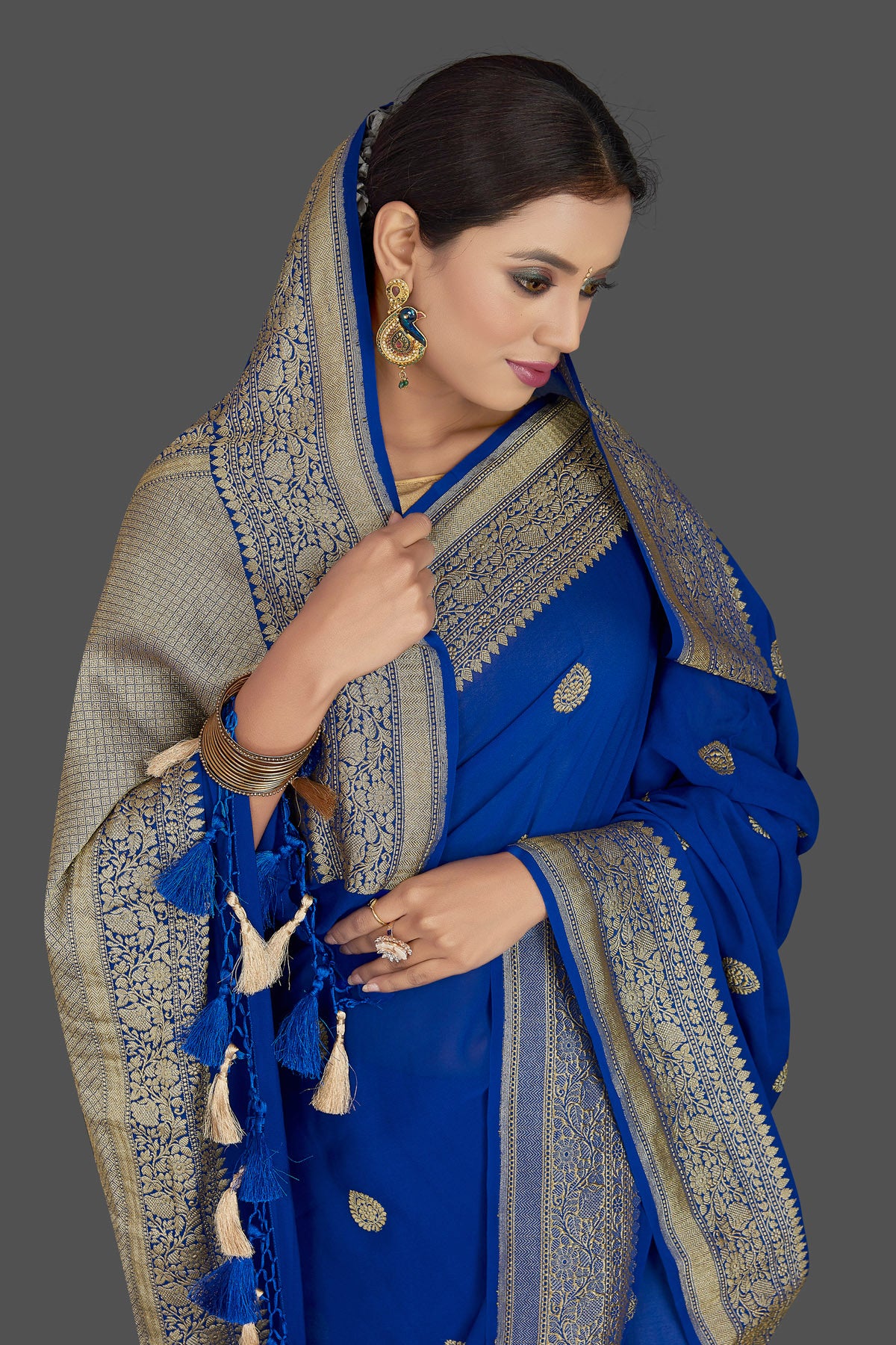 Shop beautiful indigo blue georgette Banarasi saree online in USA with zari border. Radiate elegance with georgette sarees, Banarasi sarees, handwoven sarees from Pure Elegance Indian fashion boutique in USA. We bring a especially curated collection of ethnic sarees for Indian women in USA under one roof!-closeup