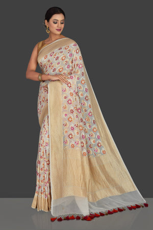 Buy beautiful cream georgette Banarasi sari online in USA with zari minakari floral work. Radiate elegance with georgette sarees, Banarasi sarees, handwoven sarees from Pure Elegance Indian fashion boutique in USA. We bring a especially curated collection of ethnic sarees for Indian women in USA under one roof!-pallu