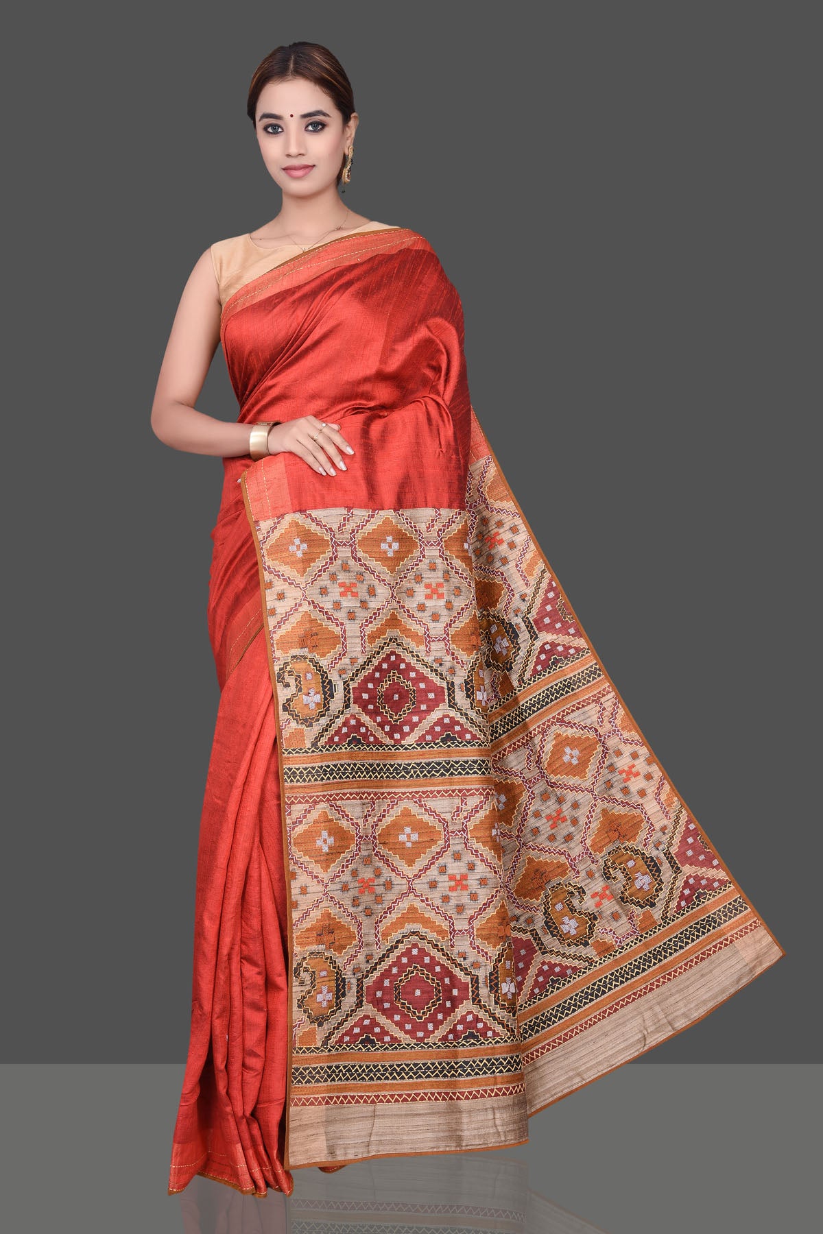 Buy beautiful brick red Kantha work raw silk sari online in USA. Shop beautiful silk sarees, hand embroidered saris, georgette sarees, designer sarees in USA from Pure Elegance Indian fashion store in USA. Shop online now.-front