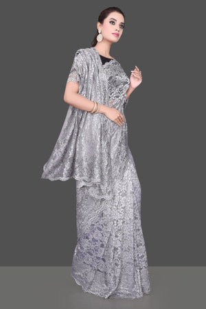 Shop beautiful light grey stone work designer lace saree online in USA. Be the talk of the parties and special occasions with stunning embroidered sarees, designer saris, pure silk sarees, fancy sarees from Pure Elegance Indian fashion store in USA.-side