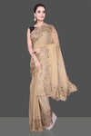 Shop stunning beige color stone work georgette saree online in USA. Be the talk of the parties and special occasions with stunning embroidered sarees, designer sarees, pure silk saris, Bollywood sarees from Pure Elegance Indian fashion store in USA.-full view