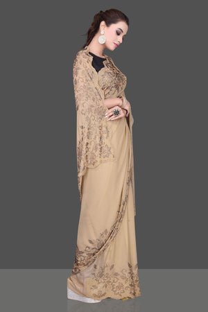 Shop stunning beige color stone work georgette saree online in USA. Be the talk of the parties and special occasions with stunning embroidered sarees, designer sarees, pure silk saris, Bollywood sarees from Pure Elegance Indian fashion store in USA.-side