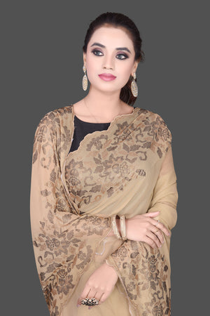 Shop stunning beige color stone work georgette saree online in USA. Be the talk of the parties and special occasions with stunning embroidered sarees, designer sarees, pure silk saris, Bollywood sarees from Pure Elegance Indian fashion store in USA.-closeup