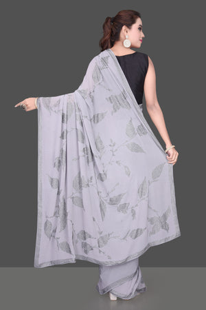 Shop gorgeous grey stone work georgette saree online in USA. Be the talk of the parties and special occasions with stunning embroidered sarees, designer sarees, pure silk saris, Bollywood sarees from Pure Elegance Indian fashion store in USA.-back
