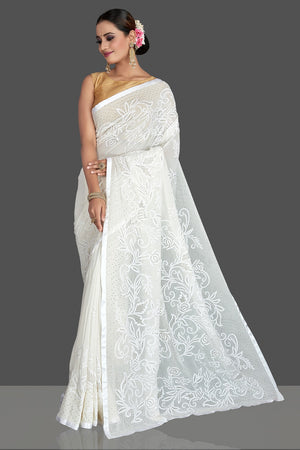 Buy stunning off-white Lucknowi chikankari georgette saree online in USA. Flaunt your sartorial choice with beautiful embroidered sarees, handwoven saris, georgette sarees, pure silk sarees from Pure Elegance Indian saree store in USA.-left