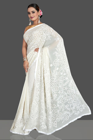 Shop beautiful off-white Lucknowi chikankari georgette sari online in USA. Flaunt your sartorial choice with beautiful embroidered sarees, handwoven sarees, georgette sarees, pure silk sarees from Pure Elegance Indian saree store in USA.-pallu