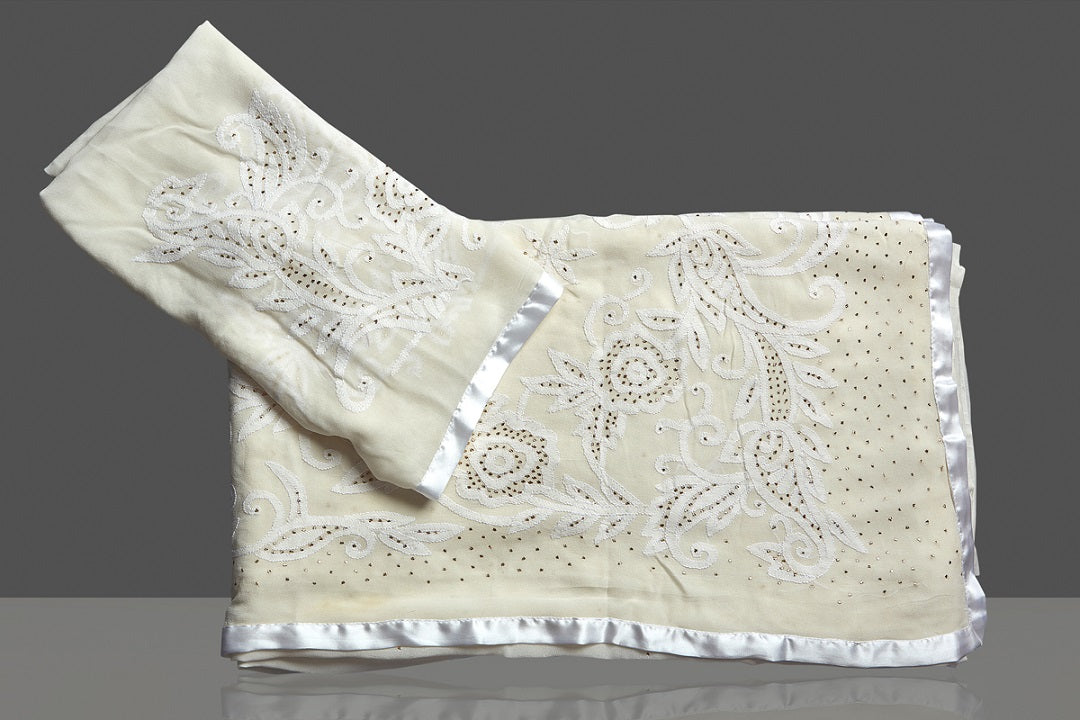 Shop beautiful off-white Lucknowi chikankari georgette sari online in USA. Flaunt your sartorial choice with beautiful embroidered sarees, handwoven sarees, georgette sarees, pure silk sarees from Pure Elegance Indian saree store in USA.-blouse