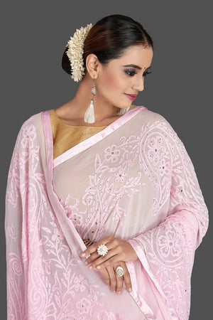 Buy gorgeous light pink Lucknowi chikankari work georgette saree online in USA. Flaunt your sartorial choice with beautiful embroidered sarees, handwoven sarees, georgette sarees, pure silk sarees from Pure Elegance Indian saree store in USA.-closeup