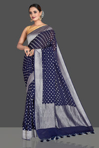 Buy beautiful dark blue georgette Banarasi saree online in USA with silver zari border and buta. Elevate your traditional style with beautiful Banarasi sarees, designer sarees, pure silk sarees, handwoven saris from Pure Elegance Indian saree store in USA.-full view