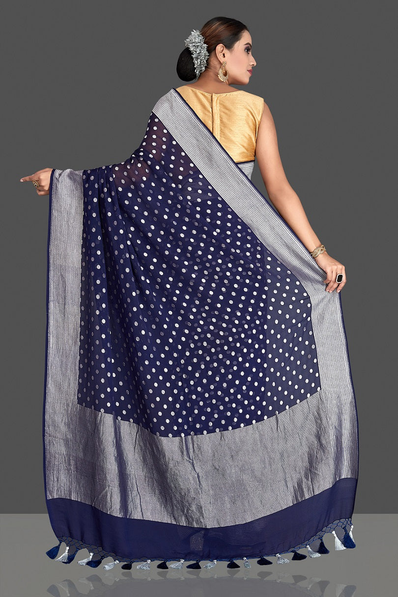 Buy beautiful dark blue georgette Banarasi saree online in USA with silver zari border and buta. Elevate your traditional style with beautiful Banarasi sarees, designer sarees, pure silk sarees, handwoven saris from Pure Elegance Indian saree store in USA.-back