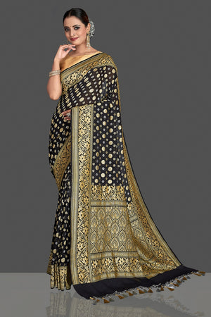 Buy beautiful black georgette Banarasi saree online in USA with golden zari work. Elevate your traditional style with beautiful Banarasi sarees, designer sarees, pure silk sarees, handwoven saris from Pure Elegance Indian saree store in USA.-side