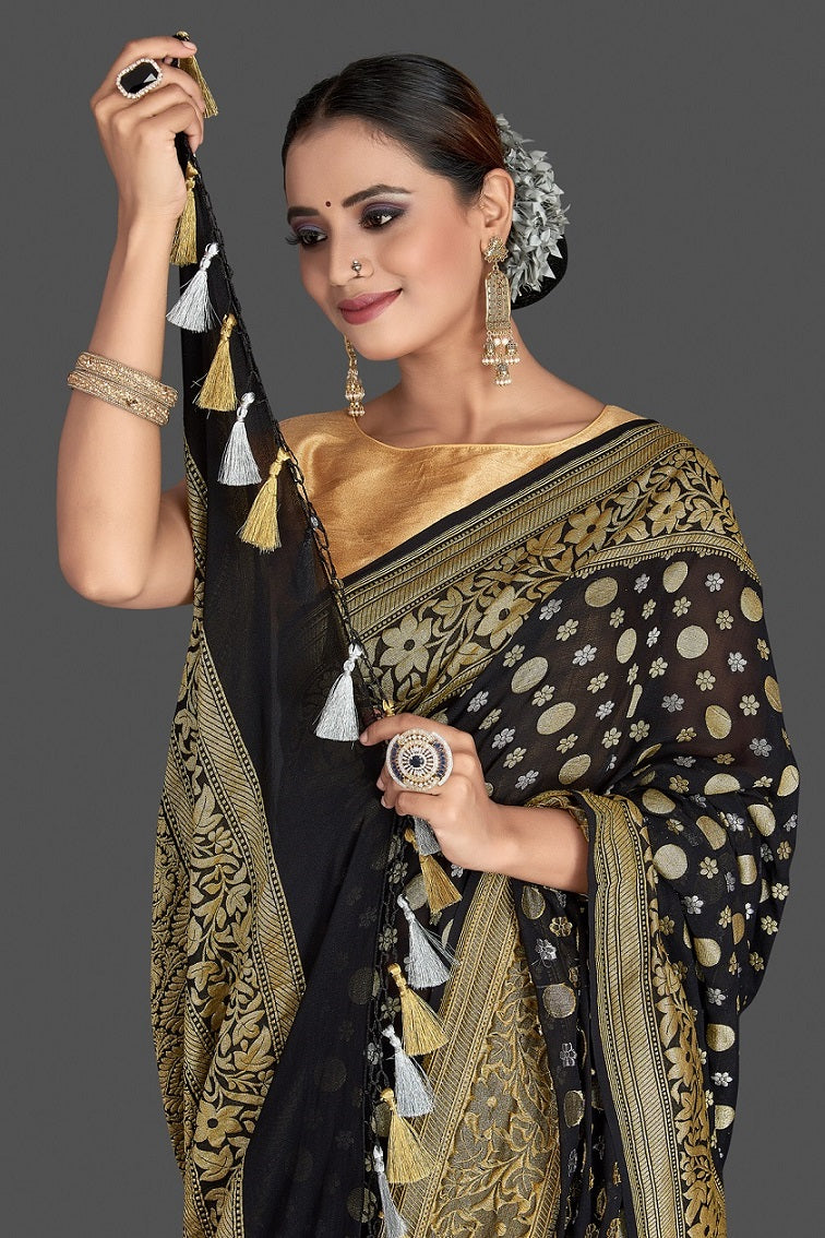 Buy beautiful black georgette Banarasi saree online in USA with golden zari work. Elevate your traditional style with beautiful Banarasi sarees, designer sarees, pure silk sarees, handwoven saris from Pure Elegance Indian saree store in USA.-closeup