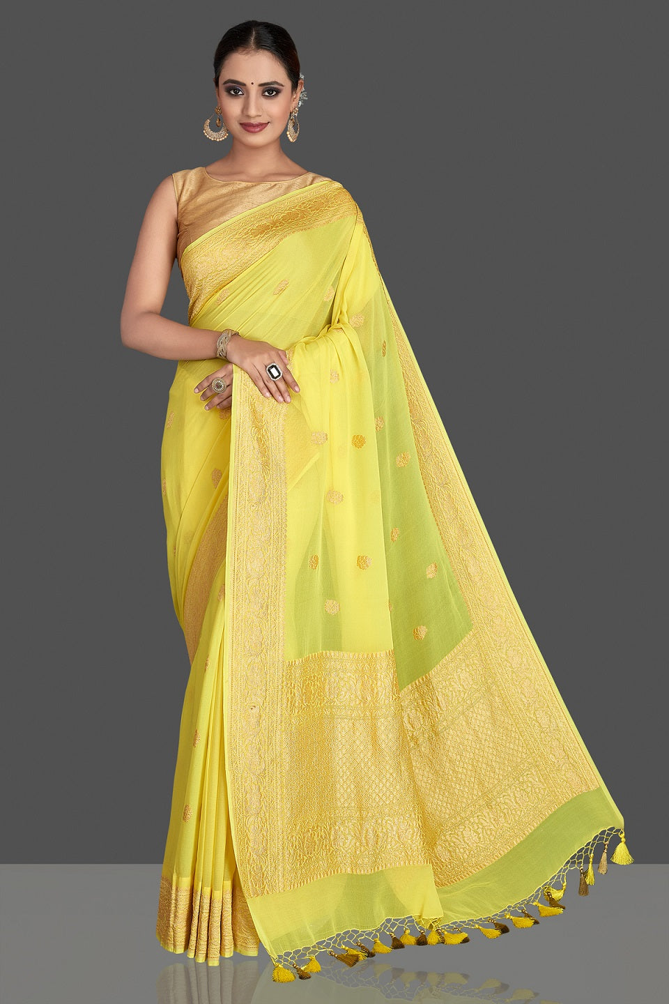 Shop gorgeous bright yellow georgette Banarasi saree online in USA with golden zari work. Elevate your traditional style with beautiful Banarasi sarees, designer sarees, pure silk sarees, handwoven saris from Pure Elegance Indian saree store in USA.-full view