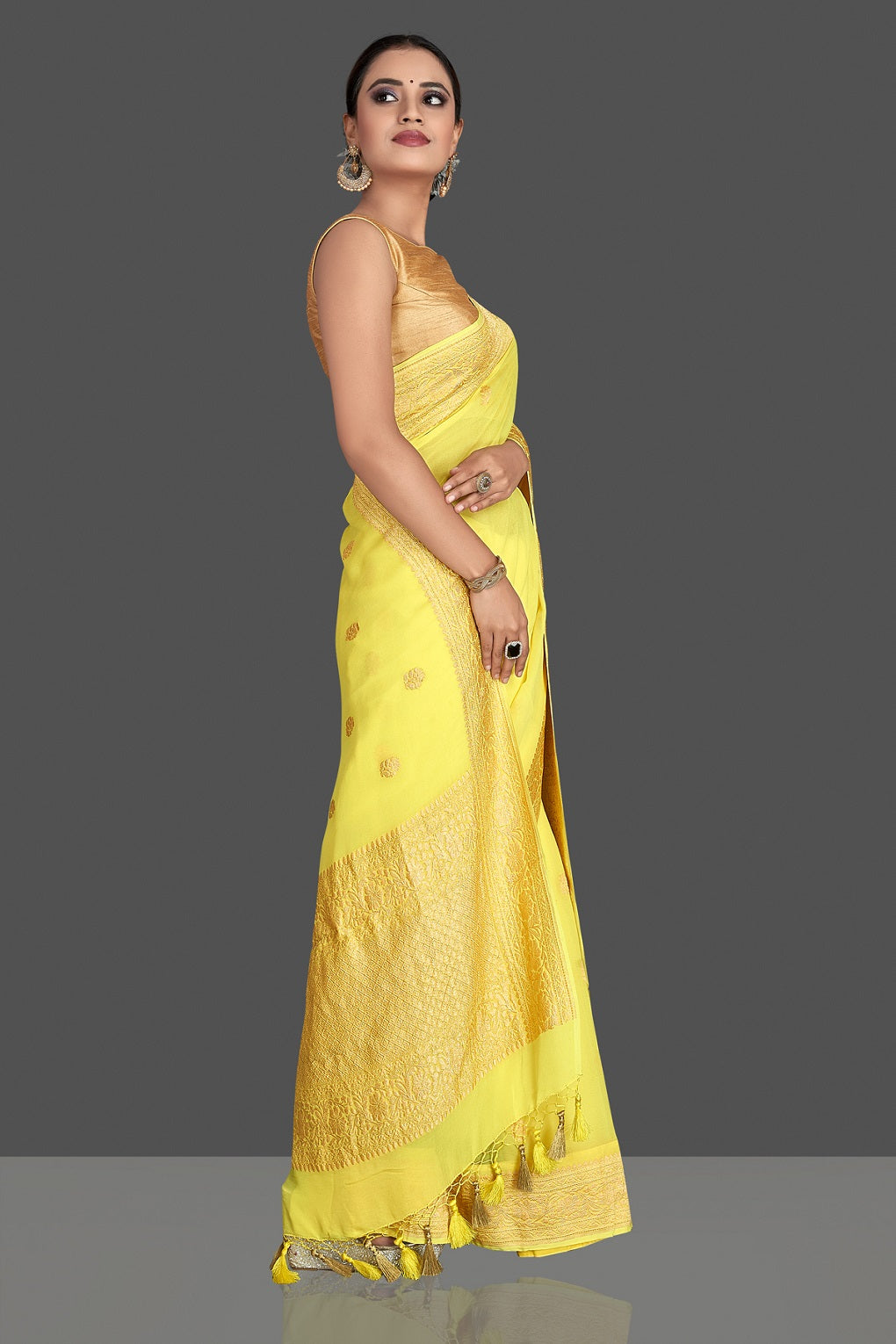 Shop gorgeous bright yellow georgette Banarasi saree online in USA with golden zari work. Elevate your traditional style with beautiful Banarasi sarees, designer sarees, pure silk sarees, handwoven saris from Pure Elegance Indian saree store in USA.-side