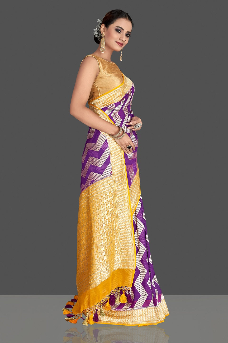 Buy beautiful purple georgette Banarasi saree online in USA with yellow zari border. Elevate your traditional style with beautiful Banarasi sarees, designer sarees, pure silk sarees, handwoven saris from Pure Elegance Indian saree store in USA.-right
