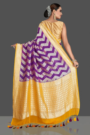 Buy beautiful purple georgette Banarasi saree online in USA with yellow zari border. Elevate your traditional style with beautiful Banarasi sarees, designer sarees, pure silk sarees, handwoven saris from Pure Elegance Indian saree store in USA.-back