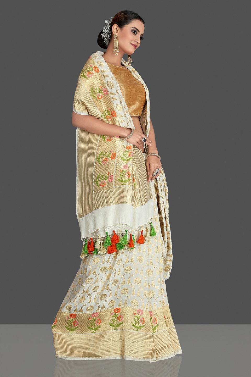Buy beautiful off-white georgette Banarasi saree online in USA with zari minakari buta on golden zari border. Elevate your traditional style with beautiful Banarasi sarees, designer sarees, pure silk sarees, handwoven saris from Pure Elegance Indian saree store in USA.-side