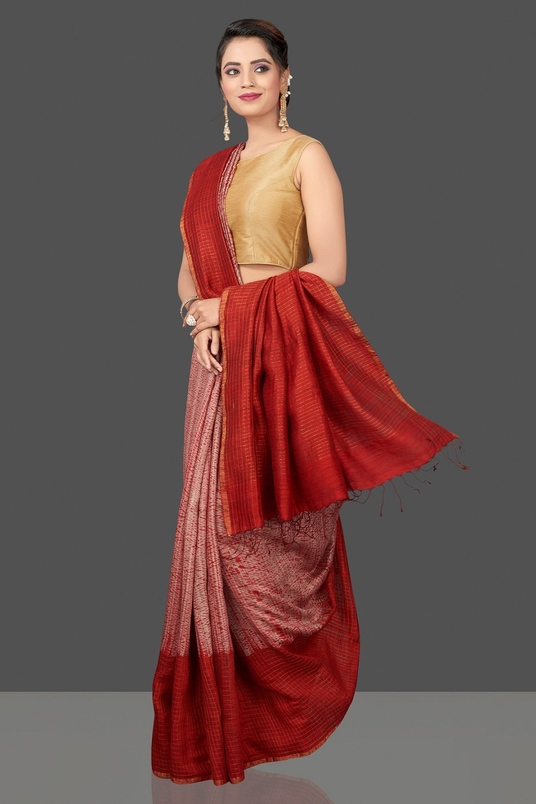Buy stunning pink and red matka shibori saree online in USA with check zari border. Flaunt Indian fashion in USA with a stunning collection of handwoven sarees, cotton sarees, pure silk sarees, printed saris in USA from Pure Elegance Indian saree store in USA.-side
