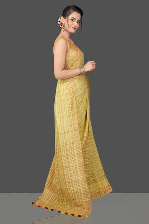 Shops stunning lime green striped Ketia saree online in USA. Flaunt Indian fashion in USA with a stunning collection of handwoven sarees, cotton saris, pure silk sarees, printed saris in USA from Pure Elegance Indian saree store in USA.-side