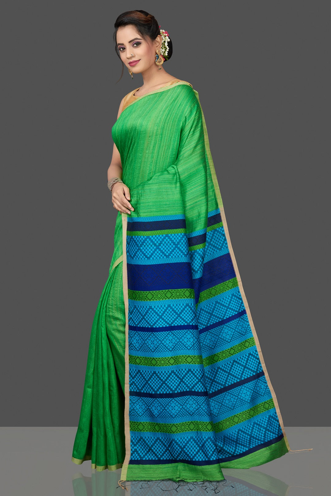 Shop stunning green Mizo matka saree online in USA with blue pallu. Flaunt Indian fashion in USA with a stunning collection of handwoven sarees, cotton saris, pure silk sarees, printed saris in USA from Pure Elegance Indian saree store in USA.-pallu