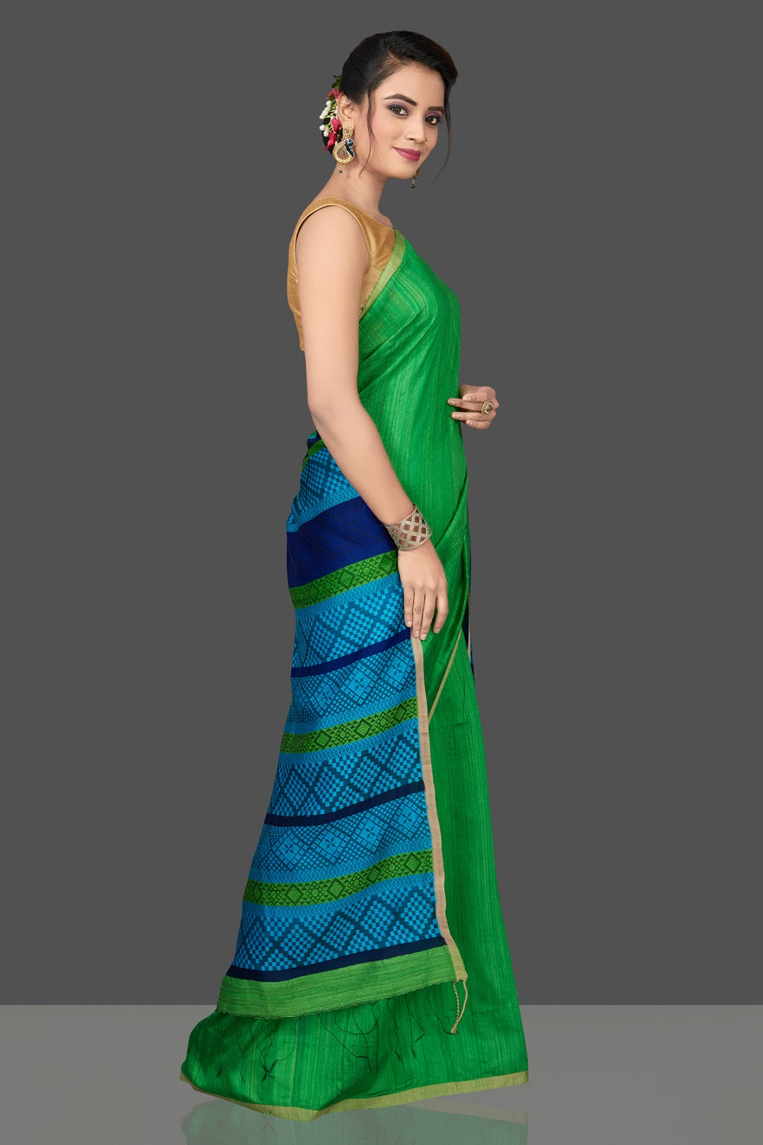 Shop stunning green Mizo matka saree online in USA with blue pallu. Flaunt Indian fashion in USA with a stunning collection of handwoven sarees, cotton saris, pure silk sarees, printed saris in USA from Pure Elegance Indian saree store in USA.-side