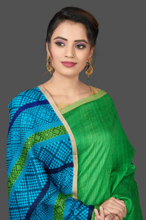 Shop stunning green Mizo matka saree online in USA with blue pallu. Flaunt Indian fashion in USA with a stunning collection of handwoven sarees, cotton saris, pure silk sarees, printed saris in USA from Pure Elegance Indian saree store in USA.-closeup