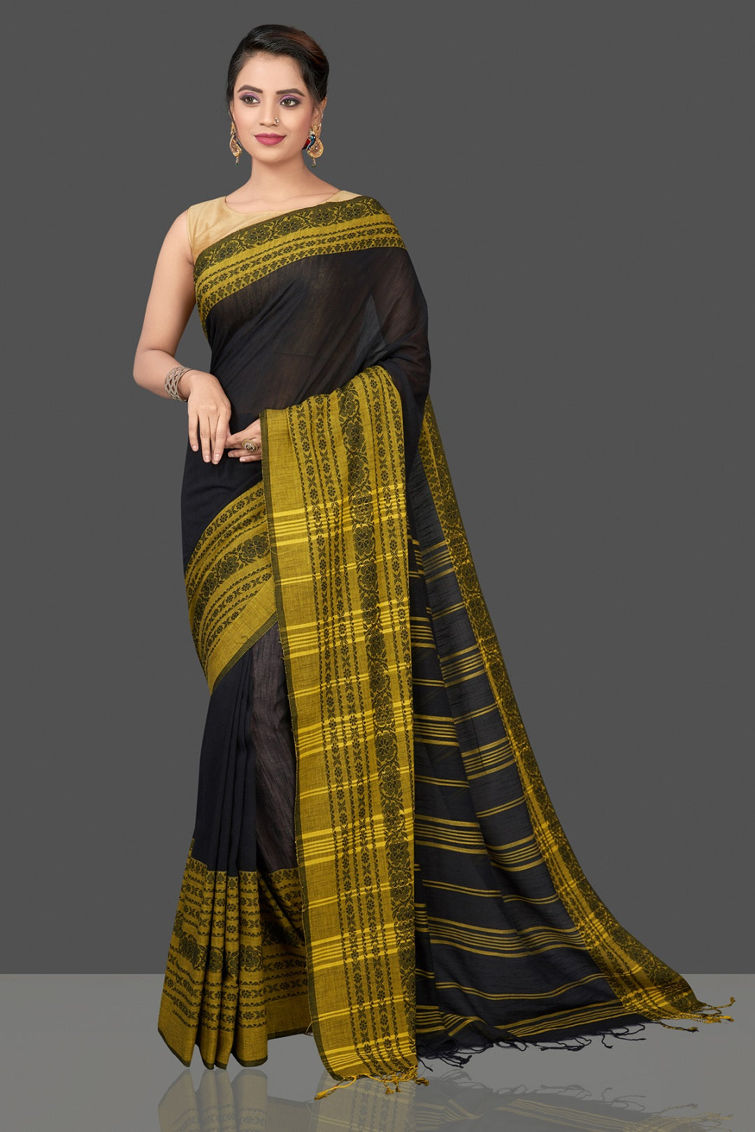 Buy gorgeous black Dongria cotton saree online in USA with yellow weave border. Flaunt Indian fashion in USA with a stunning collection of handwoven sarees, cotton saris, pure silk sarees, printed saris in USA from Pure Elegance Indian saree store in USA.-front