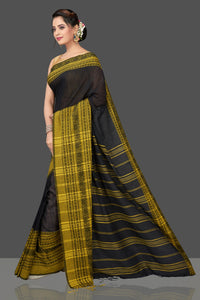 Buy gorgeous black Dongria cotton saree online in USA with yellow weave border. Flaunt Indian fashion in USA with a stunning collection of handwoven sarees, cotton saris, pure silk sarees, printed saris in USA from Pure Elegance Indian saree store in USA.-full view