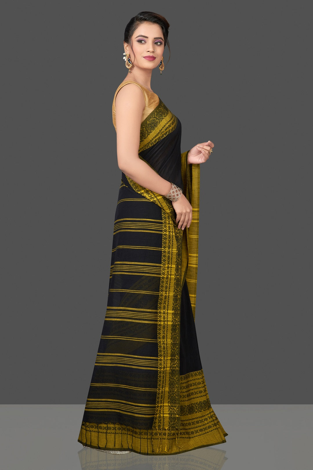 Buy gorgeous black Dongria cotton saree online in USA with yellow weave border. Flaunt Indian fashion in USA with a stunning collection of handwoven sarees, cotton saris, pure silk sarees, printed saris in USA from Pure Elegance Indian saree store in USA.-side
