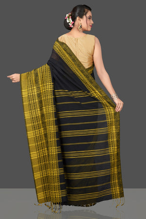 Buy gorgeous black Dongria cotton saree online in USA with yellow weave border. Flaunt Indian fashion in USA with a stunning collection of handwoven sarees, cotton saris, pure silk sarees, printed saris in USA from Pure Elegance Indian saree store in USA.-back