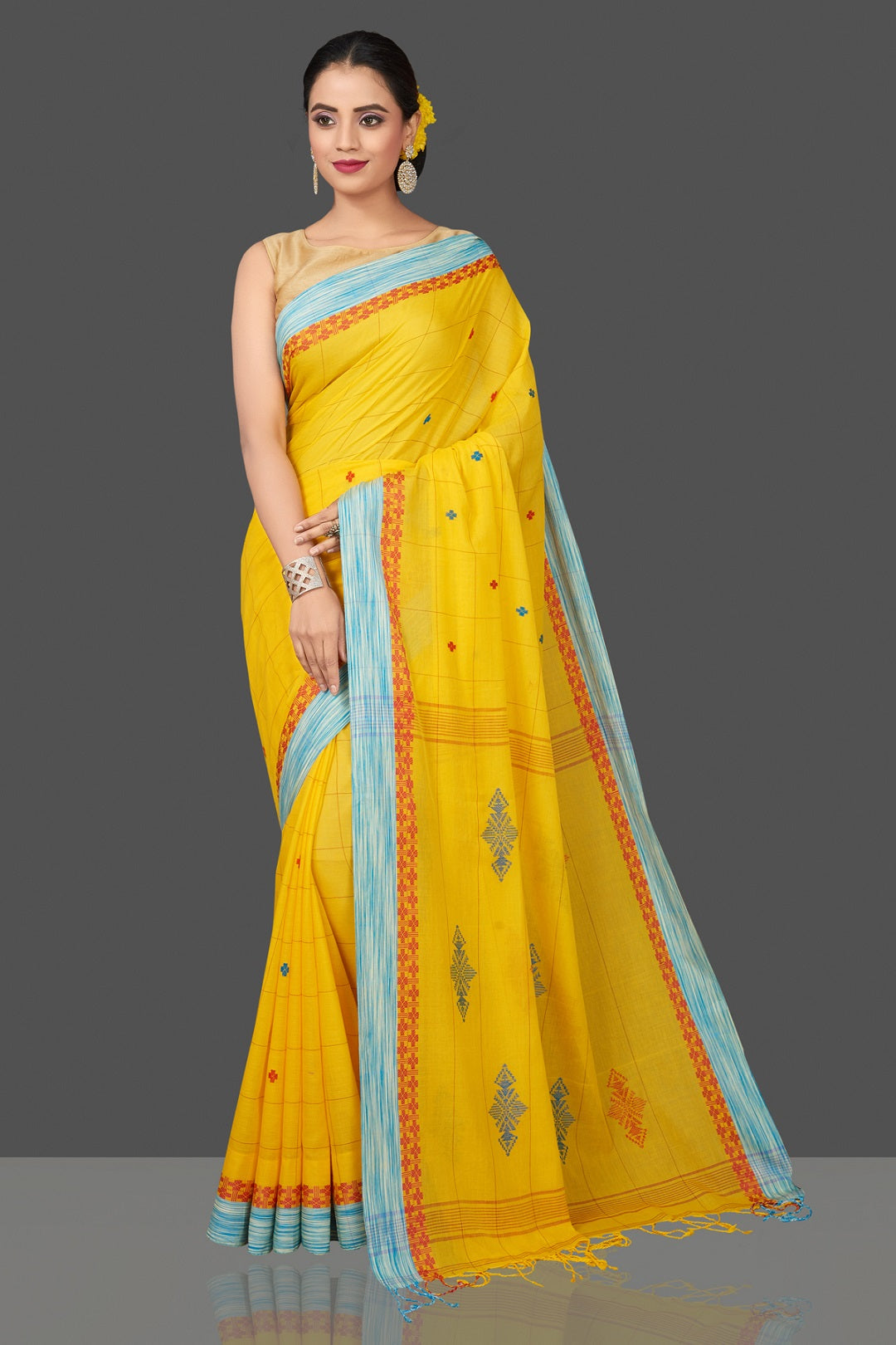 Shop stunning yellow cotton saree online in USA with blue border. Flaunt Indian fashion in USA with a stunning collection of handwoven sarees, cotton saris, pure silk sarees, printed saris in USA from Pure Elegance Indian saree store in USA.-full view