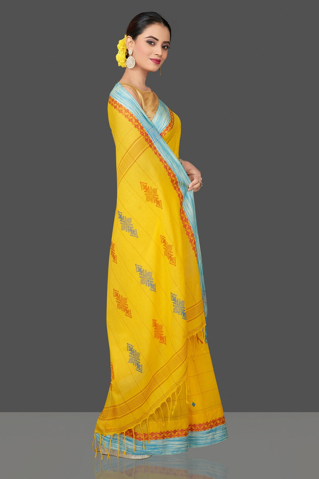 Shop stunning yellow cotton saree online in USA with blue border. Flaunt Indian fashion in USA with a stunning collection of handwoven sarees, cotton saris, pure silk sarees, printed saris in USA from Pure Elegance Indian saree store in USA.-side