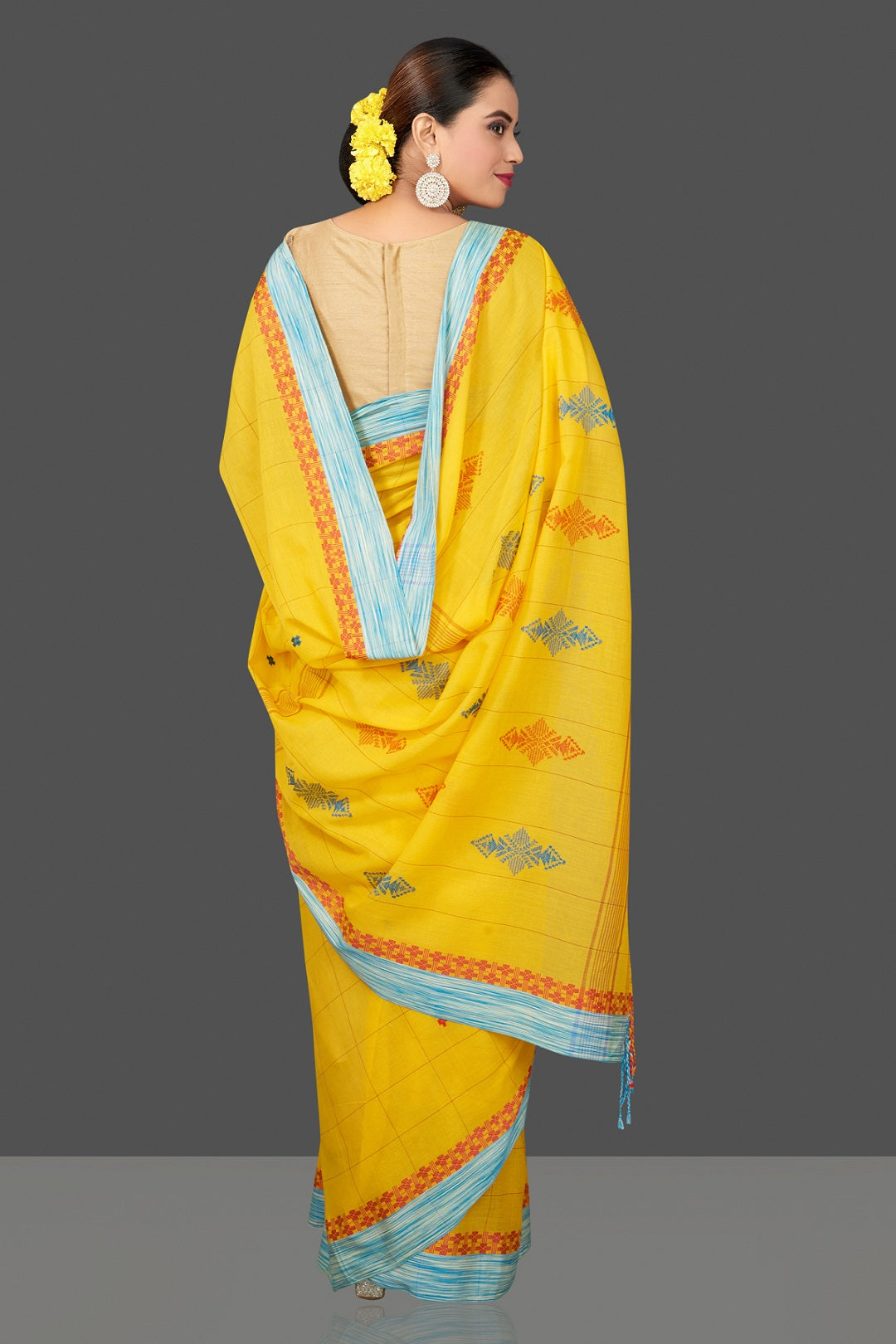 Shop stunning yellow cotton saree online in USA with blue border. Flaunt Indian fashion in USA with a stunning collection of handwoven sarees, cotton saris, pure silk sarees, printed saris in USA from Pure Elegance Indian saree store in USA.-back